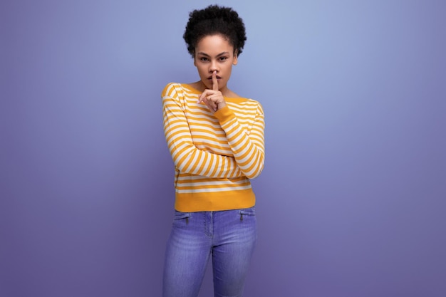 Model latina young woman with afro hair on studio background