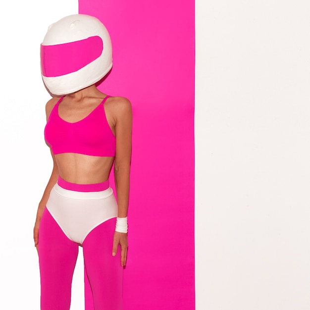 Model in a motorcycle helmet. Minimal fashion art