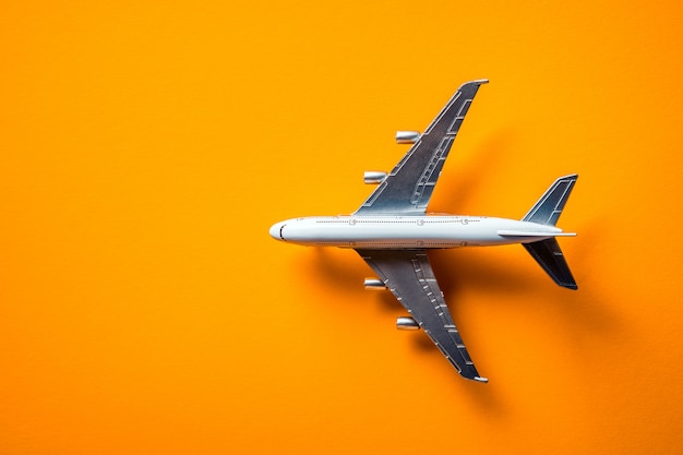 Model plane, airplane isolated on yellow 