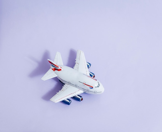 Model plane,airplane on violet color space