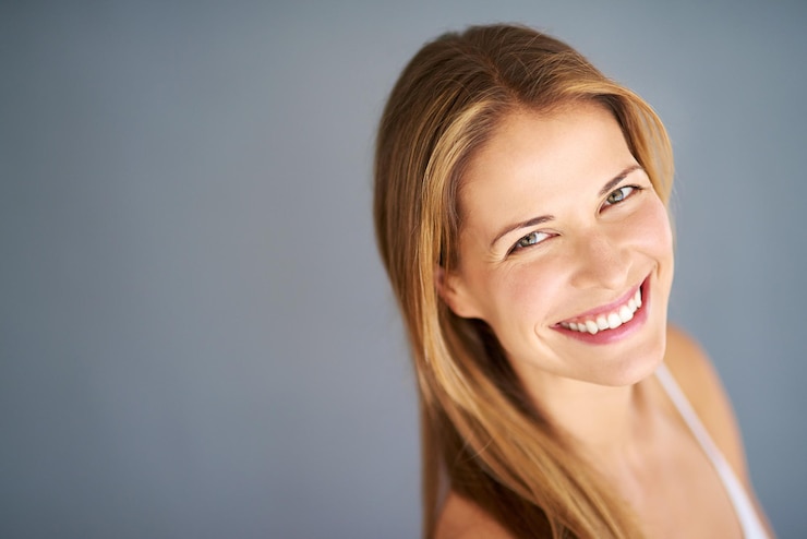 Photo model portrait and confidence with glow beauty and hairstyle for hair care or cosmetics woman smile and keratin treatment for salon shine or aesthetic mockup isolated on gray studio background