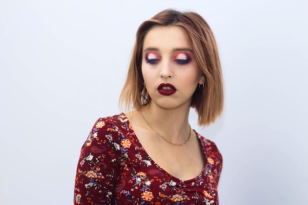 Model posing for the camera on a white background