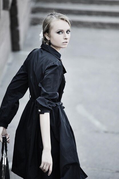 Model posing on a city street