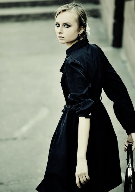 Model posing on a city street