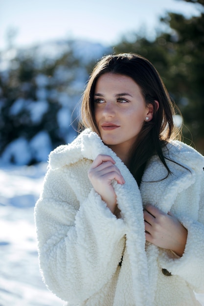 model posing in the snow with swimsuit