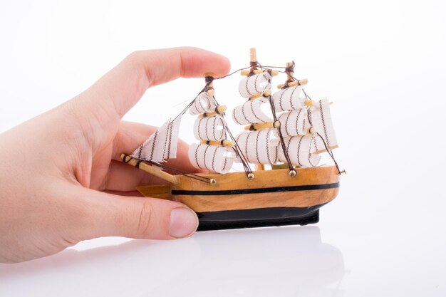 model sailboat and hand