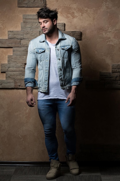 Model Standing Strong Against a Brick Background