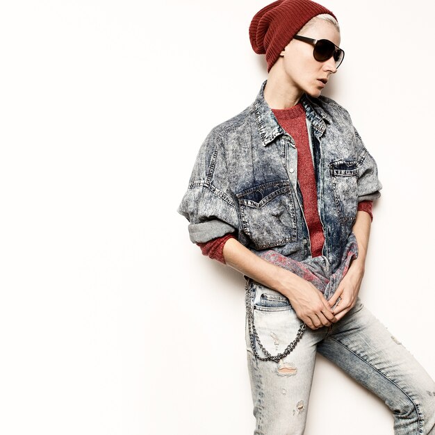 Model Tomboy hipster concept Blue denim clothes Stylish fashion Urban Style Beanie Rock style