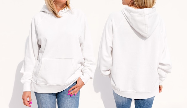 Model wearing white women's hoodie mockup for your own design