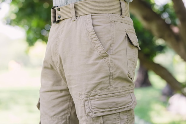 Photo model wearing yellow brown color cargo pants or cargo trousers