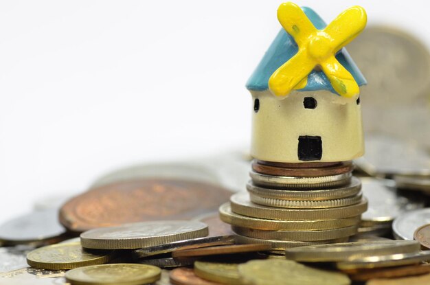 Model windmill on stack of coins