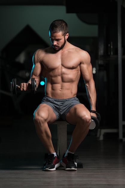 Model With Dumbbells Exercising Biceps