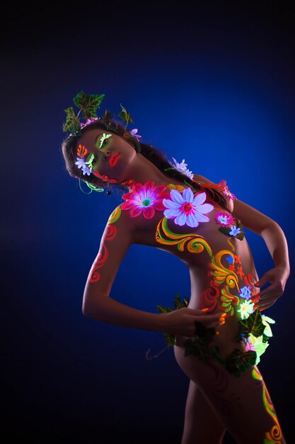 Photo model with luminescent body art