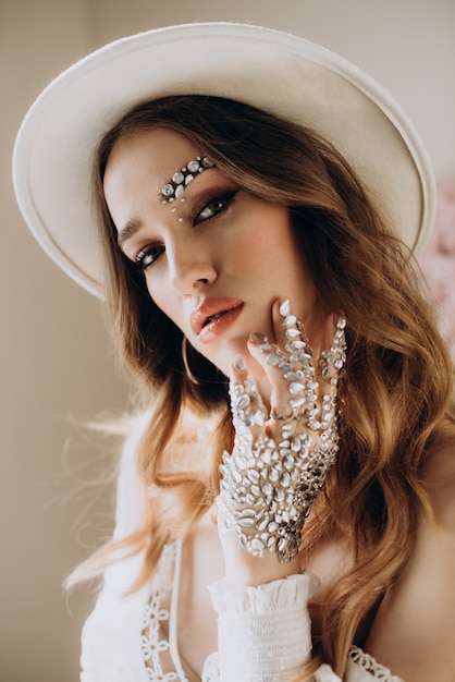 Model woman with hat and jewelry