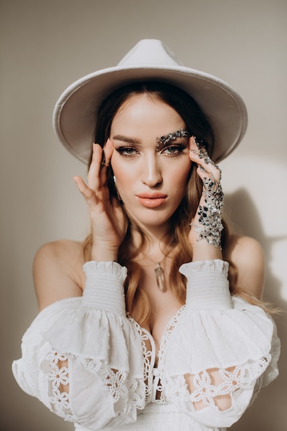 Model woman with hat and jewelry