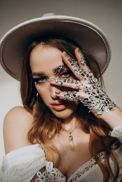 Model woman with hat and jewelry