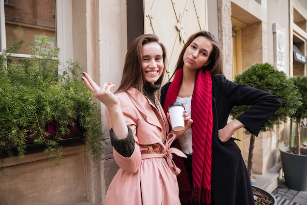 Models in coats looking at camera.