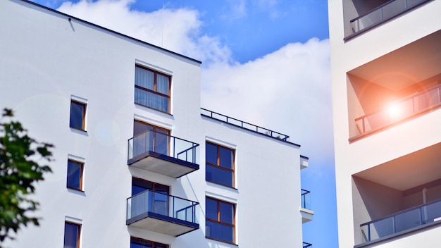 Modern apartment building in sunny day Exterior residential house facade