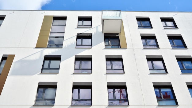 Modern apartment building on a sunny day with a blue sky Facade of a modern apartment building