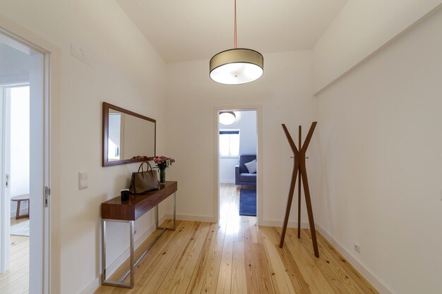 Modern apartment with white walls and light wooden floor