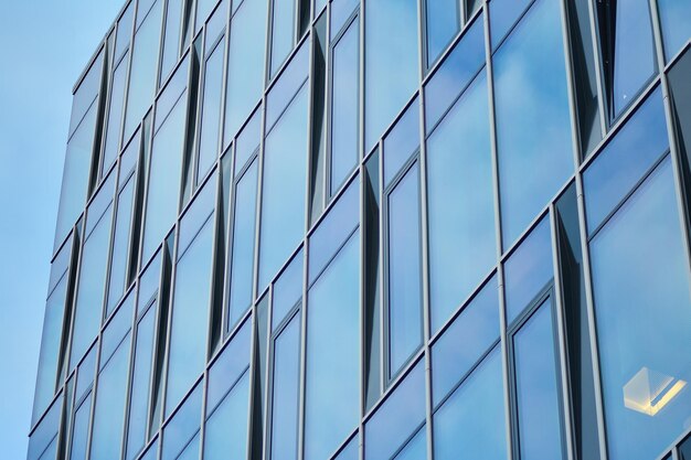 modern architecture with sun ray glass facade on a bright sunny day