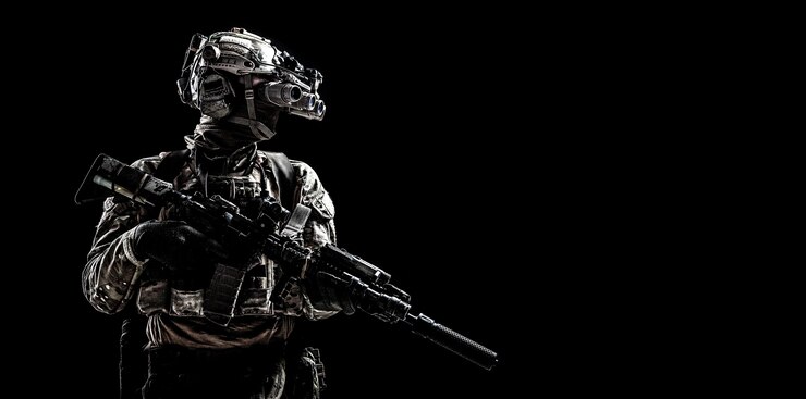 Photo 現代の軍の特殊部隊は、兵士、反テロリストの分隊戦闘機、エリート傭兵の武装アサルトライフルを装備し、暗視ゴーグルをヘルメットに付けて暗闇の中に立っています、スタジオポートレート、コピースペース