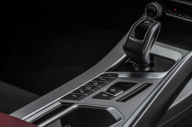 Modern automatic gearbox. Close up of the gearbox transmission handle. Automatic gear stick.