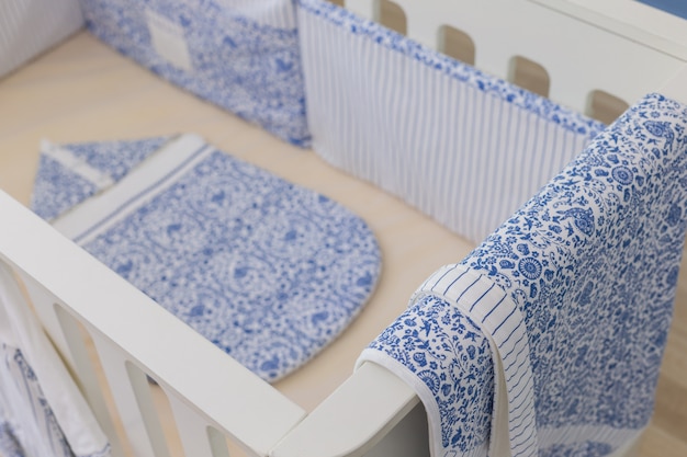 Modern baby bedroom in white with bed