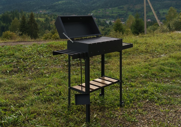 Modern barbeque grill outdoor with mountain view with copy space