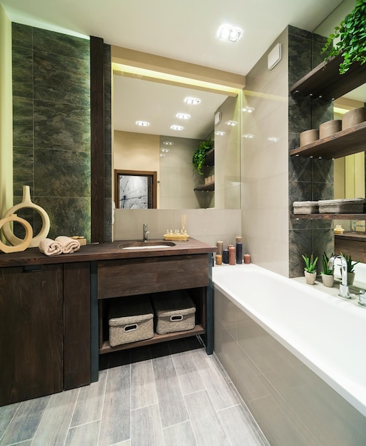 Modern bathroom decorated in eco style  with wooden furniture and green plants