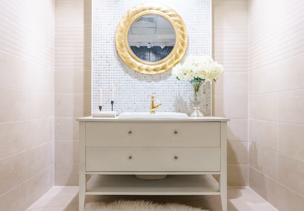 Modern bathroom interior with modern countertop basin, toilet and mirror