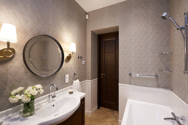 Modern bathroom interior with stone wall