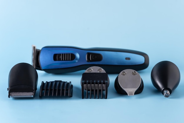 Modern battery electric shaver for man on blue background with\
clipping path horizontal