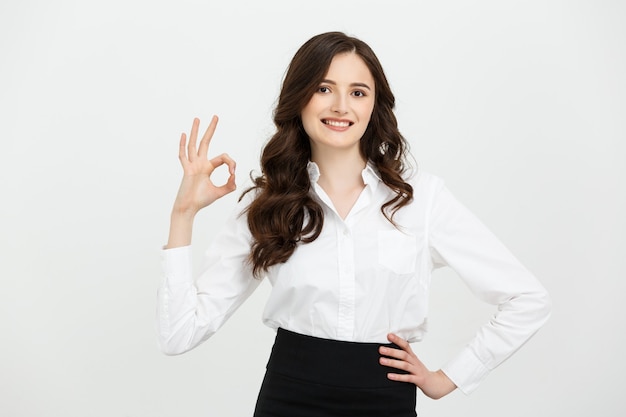 Modern beautiful business woman showing ok sign