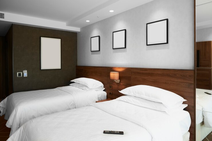 Modern bedroom interior with blank pictures on the wall