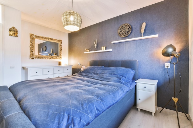 Modern bedroom interior with a stylish combination of trendy black and white mirror shelf