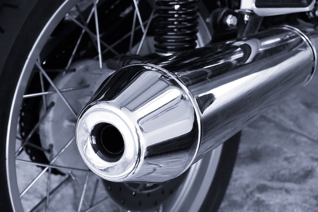 Modern big chromed exhaust on motorcycle