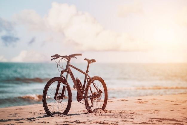 Modern bike on the beach vacation life and recreation concept fitness sports motivation and inspiration mtb on the seaside