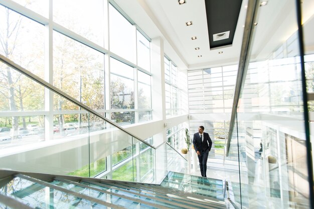 Modern black businessman on the stairs