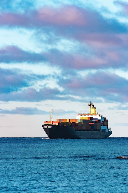 Photo modern black container ship moving from baltic sea