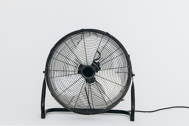 Modern black electric fan on white background