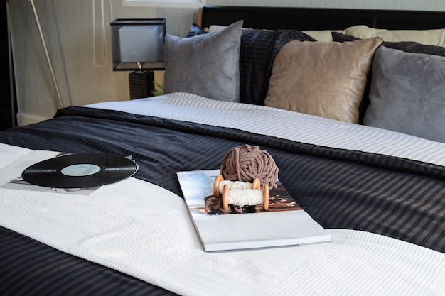 Modern black tone bedroom decorative with book, crochet and gram