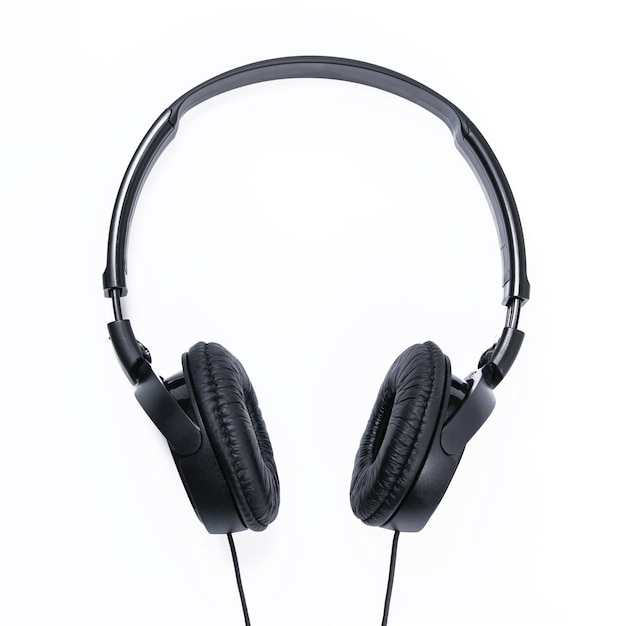 Modern black wired headphones isolated on a white background in closeup