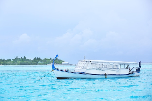 Modern boat berthed at tropical resort