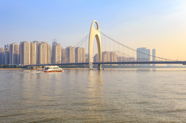 Modern bridge in Zhujiang river and modern building of financial district in guangzhou city