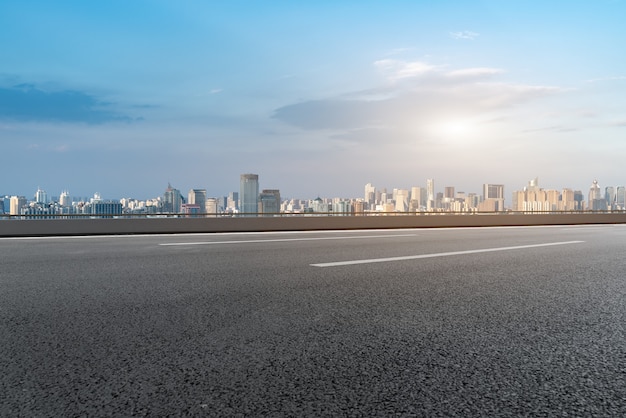 Modern building background and asphalt road in Shanghai, China