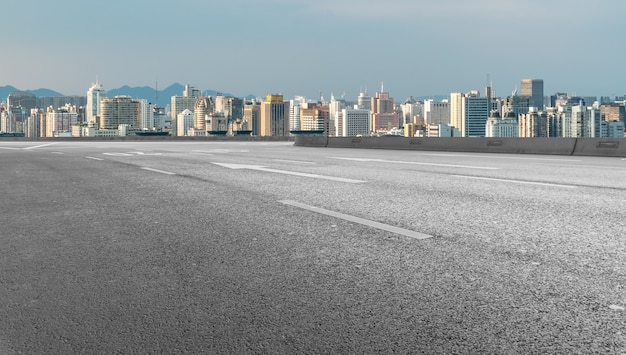 Modern building background and asphalt road in Shanghai, China