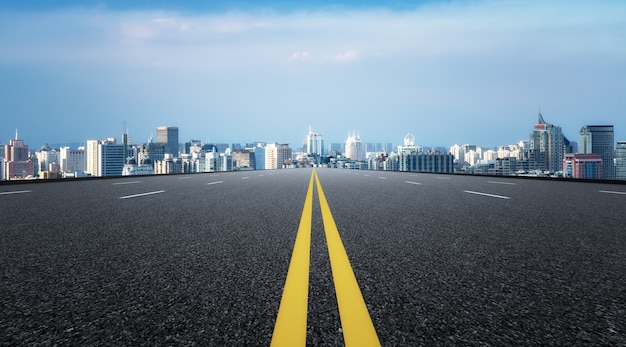 Modern building background and asphalt road in Shanghai, China