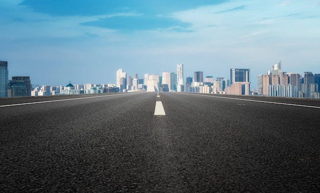 Modern building background and asphalt road in Shanghai, China