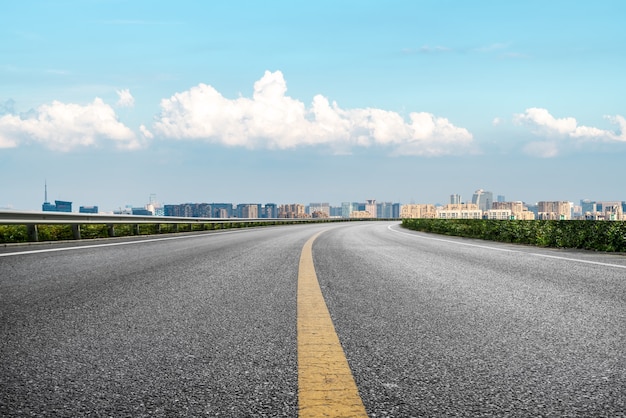 Modern building background and asphalt road in Shanghai, China